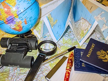 World travel - maps show you the places you'll go! Learn geography with free maps. Maps, globe magnifying glass, passport.